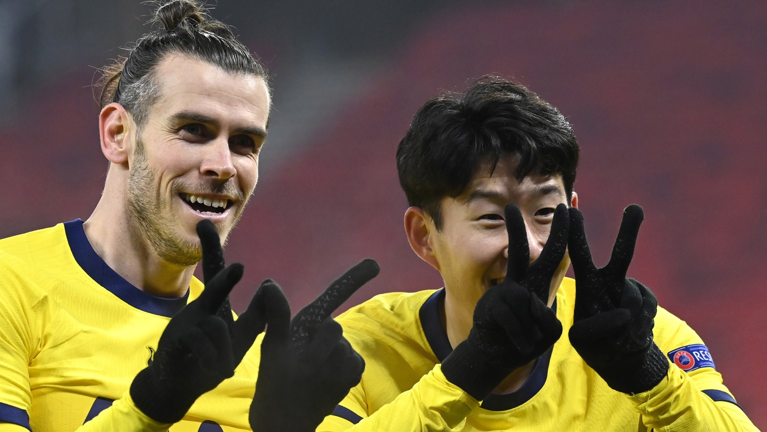 epa09022547 Tottenham players Gareth Bale (L) and Son Heung­min (R) celebrate a goal during the UEFA Europa League round of 32, first leg soccer match between Wolfsberger AC and Tottenham Hotspur at t ...