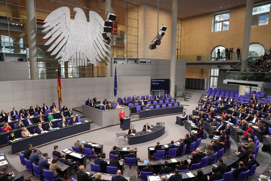 epa08028266 German Chancellor Angela Merkel speaks during a session of the &#039;Bundestag&#039; German parliament in Berlin, Germany, 27 November 2019. Members of Bundestag will gather to debate on g ...