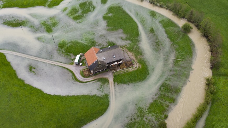 epa07588922 The river Thur swelled and flooded the area next to the riverside, in Alt St. Johann, Switzeland, 21 May 2019,. There is currently heavy rainfall in Eastern Switzerland. EPA/GIAN EHRENZELL ...