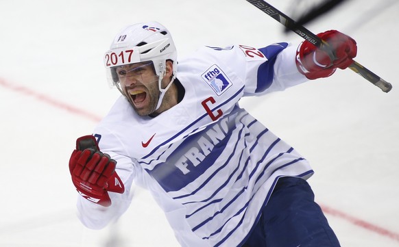France&#039;s Laurent Meunier celebrates after scoring a goal against Italy during the Group A preliminary round match at the Ice Hockey World Championship in Minsk, Belarus, Sunday, May 11, 2014. (AP ...