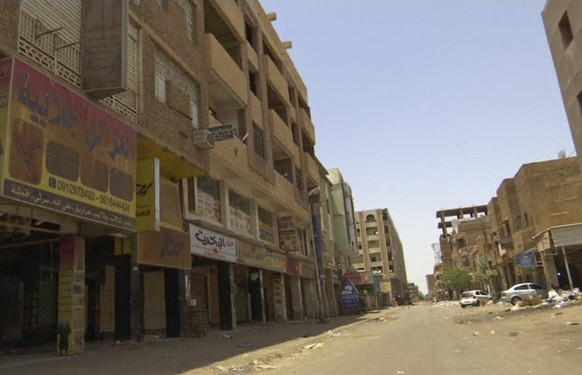 In this frame grab from video shops are closed during a general strike, in the Al-Arabi souk business district of Khartoum, Sudan, Sunday, June 9, 2019. The first day of the workweek in Sudan saw shop ...