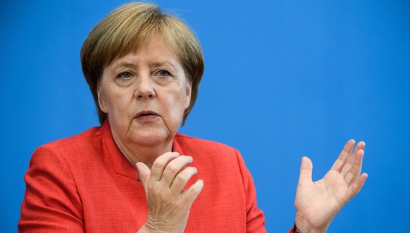 epa06899944 German Chancellor Angela Merkel gestures during for her annual press conference at &#039;Bundespressekonferenz&#039; in Berlin, Germany, 20 July 2018. The traditional media briefing usuall ...