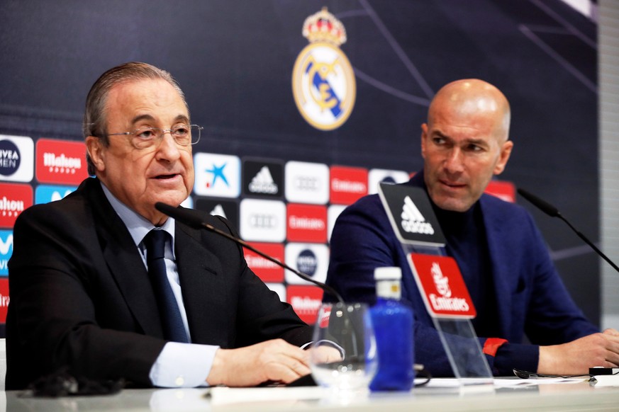 epa06775223 Real Madrid&#039;s president Florentino Perez (L) speaks next to Real Madrid&#039;s head coach Zinedine Zidane (R) during a press conference to announce Zidane&#039;s departure at Santiago ...