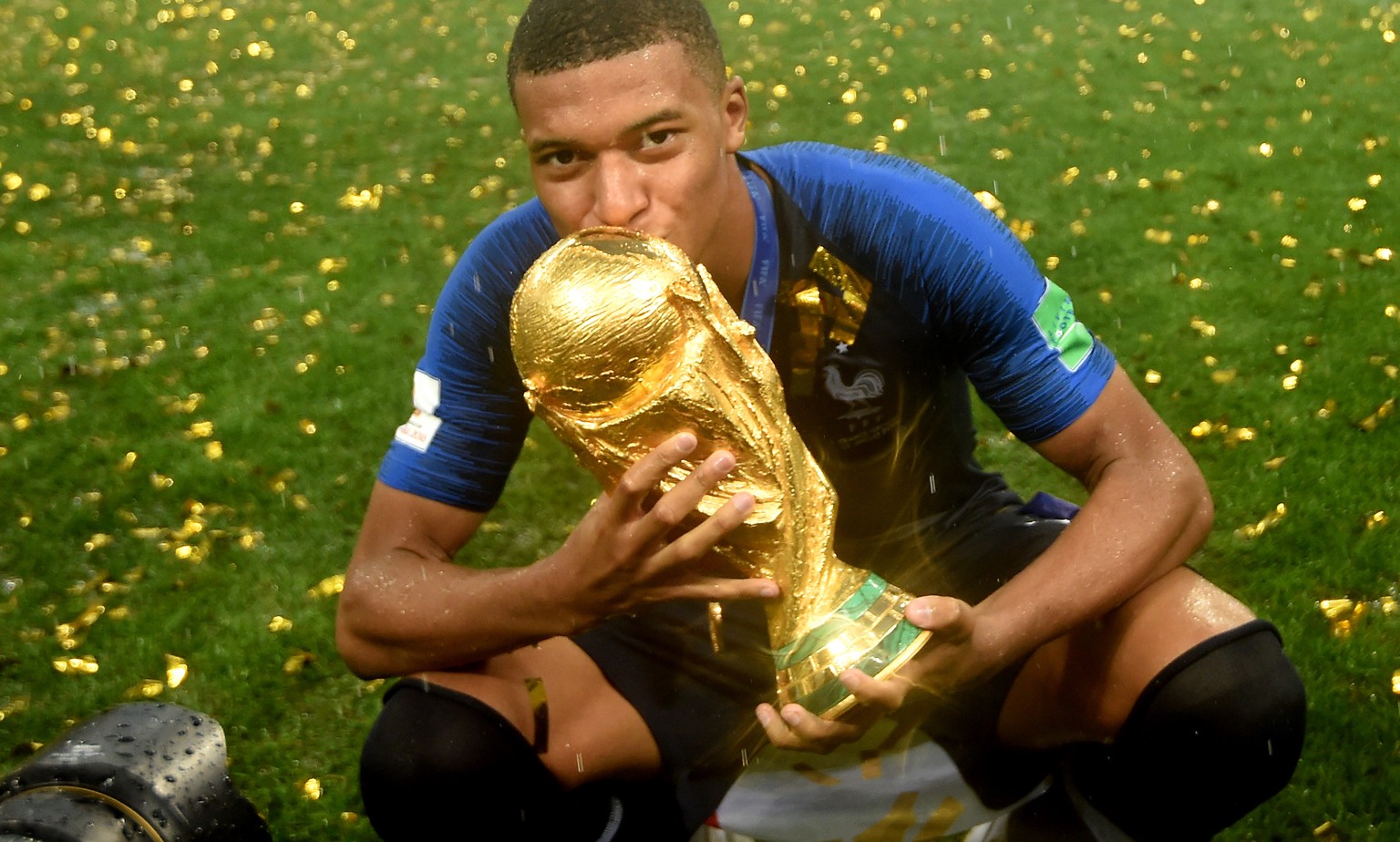 epa06891541 Kylian Mbappe of France reacts with the trophy after winning the FIFA World Cup 2018 final between France and Croatia in Moscow, Russia, 15 July 2018.

(RESTRICTIONS APPLY: Editorial Use ...
