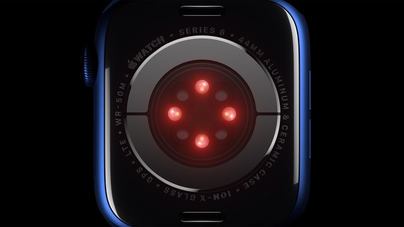 epa08671340 A handout video still image made available by Apple Inc. showing Apple Watch Series 6 featuring a revolutionary Blood Oxygen sensor and app employs LEDS, along with photodiodes on the back ...
