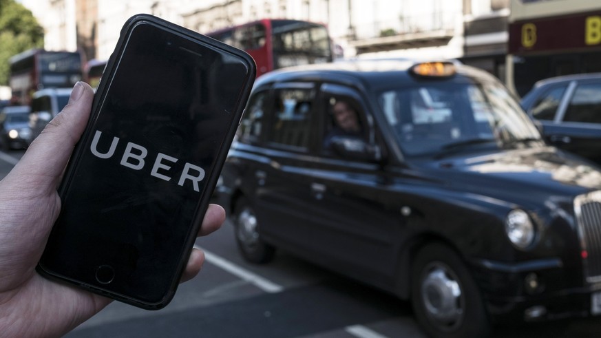 epa06355410 (FILE) - An image showing an Uber app on a mobile phone in central London, Britain, 22 September 2017. Media reports on 28 November 2017 state Japanese Softbank corporation may be close to ...