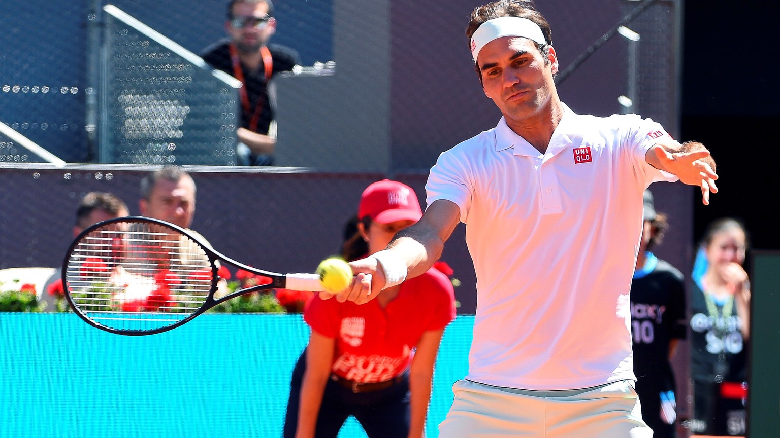 epa07558405 Roger Federer of Switzerland in action against Gael Monfils of France during their third round match of the Mutua Madrid Open tennis tournament at the Caja Magica complex in Madrid, Spain, ...