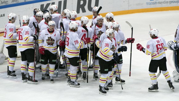 Kunlun Red Star&#039;s team players celebrate after they won the Kontinental Hockey League match against Spartak Moscow, in Moscow, Russia, Saturday, Oct. 1, 2016. (AP Photo/Pavel Golovkin)