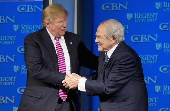 Republican presidential candidate Donald Trump shakes hands with Rev. Pat Robertson during an appearance at Regent University in Virginia Beach, Va., Wednesday, Feb. 24, 2016. (AP Photo/Steve Helber)