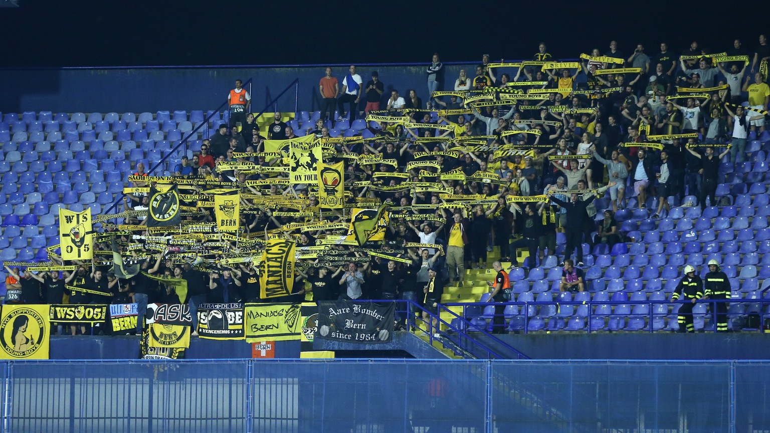 The supporters of YB cheer for their team during the UEFA Champions League football 2nd leg playoff match between GNK Dinamo Zagreb from Croatia and BSC Young Boys from Switzerland, in the Stadion Mak ...