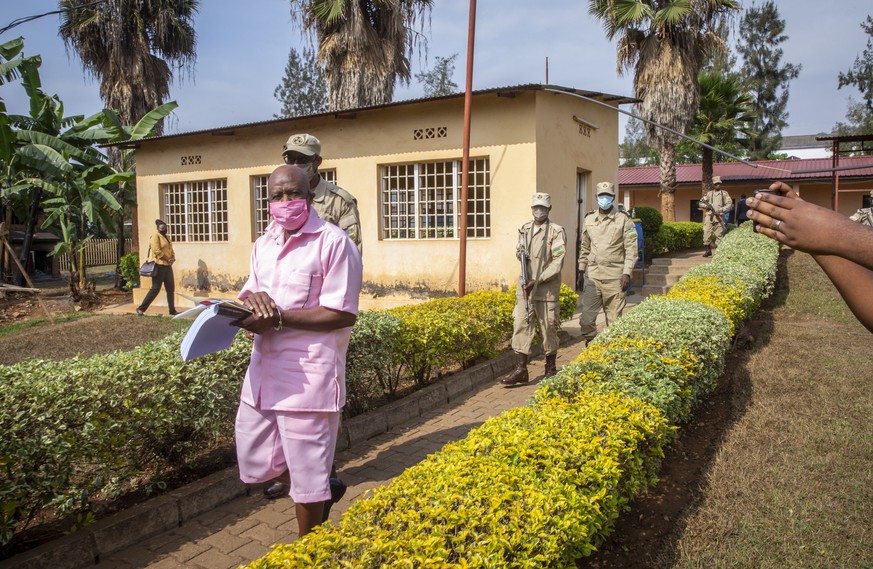 Paul Rusesabagina, whose story inspired the film &quot;Hotel Rwanda&quot;, wears a pink prison uniform as he arrives for a bail hearing at a court in the capital Kigali, Rwanda Friday, Sept. 25, 2020. ...