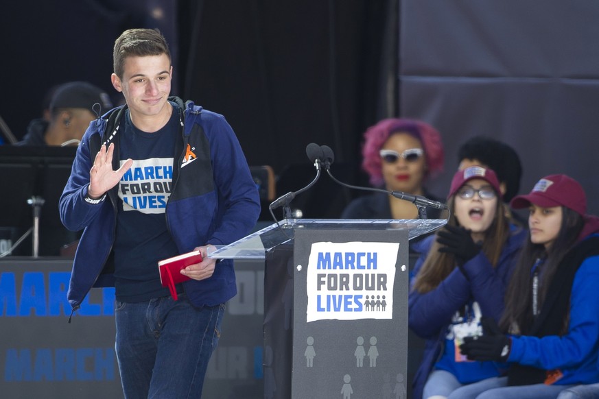 Cameron Kasky, a survivor of the mass shooting at Marjory Stoneman Douglas High School in Parkland, Fla., waves after speaking at the &quot;March for Our Lives&quot; rally in support of gun control in ...
