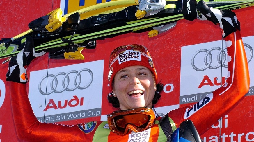 Italian Isolde Kostner celebrates on the podium after winning the downhill World Cup race on the Krummholz piste in Haus / Ennstal on Saturday, 31 January 2004. Isolde Kostner of Italy claimed her fir ...