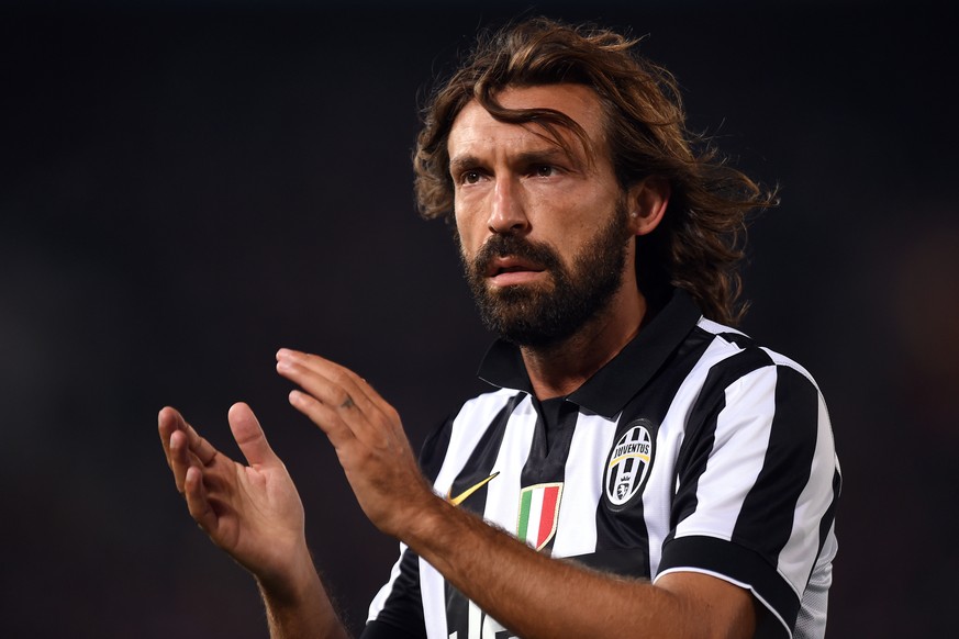 epa08592232 (FILE) - Juventus&#039; Andrea Pirlo applauds the crowd as he prepares to take a corner kick against the A-League All Stars during their friendly match at ANZ Stadium in Sydney, Australia, ...