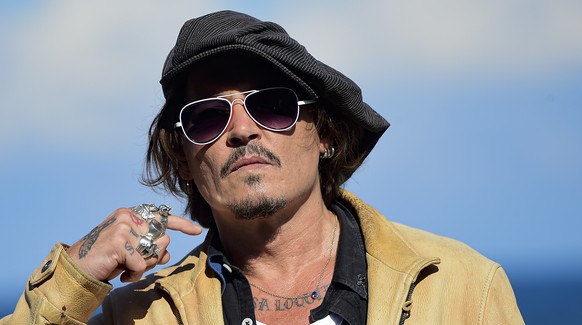 FILE - In this file photo dated Sunday, Sept. 20, 2020, US actor and film producer Johnny Deep during the photocall for his film &quot;Crock of Gold: A Few Rounds with Shane Macgoman&quot; at the 68th ...