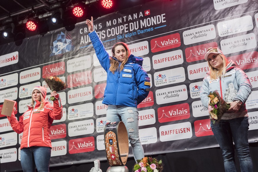 epa07391089 (L-R) Joana Haehlen of Switzerland as second, Sofia Goggia of Italy as the winner of the race and Lara Gut-Behrami of Switzerland as third, celebrate during the winner&#039;s ceremony afte ...
