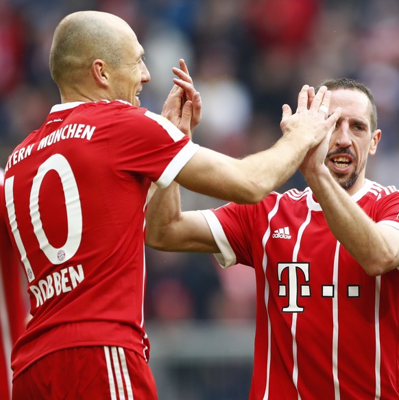 Bayern&#039;s Arjen Robben, left, celebrates with team mates Franck Ribery, center, and Corentin Tolisso after scoring his side&#039;s fourth goal during the German Soccer Bundesliga match between FC  ...