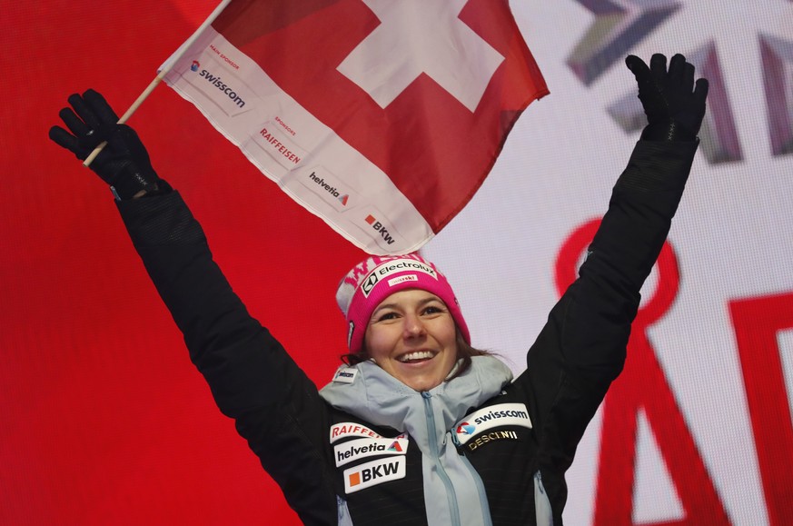 Switzerland&#039;s Wendy Holdener waves her national flag during the medal ceremony for the women&#039;s combined race, at the alpine ski World Championships in Are, Sweden, Friday, Feb. 8, 2019. (AP  ...