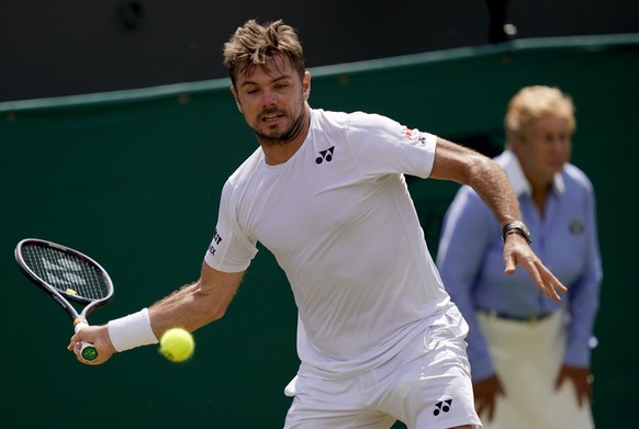 epa07691998 Stan Wawrinka of Switzerland in action against Reilly Opelka of the USA in their second round match during the Wimbledon Championships at the All England Lawn Tennis Club, in London, Brita ...