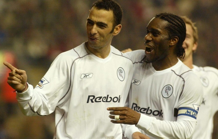 Bolton Wanderers Youri Djorkaeff (L) celebrates with Jay Jay Okocha after scoring against Liverpool, during the fourth round of the FA Carling Cup match at Anfield, Liverpool, on Wednesday, 03 Decembe ...