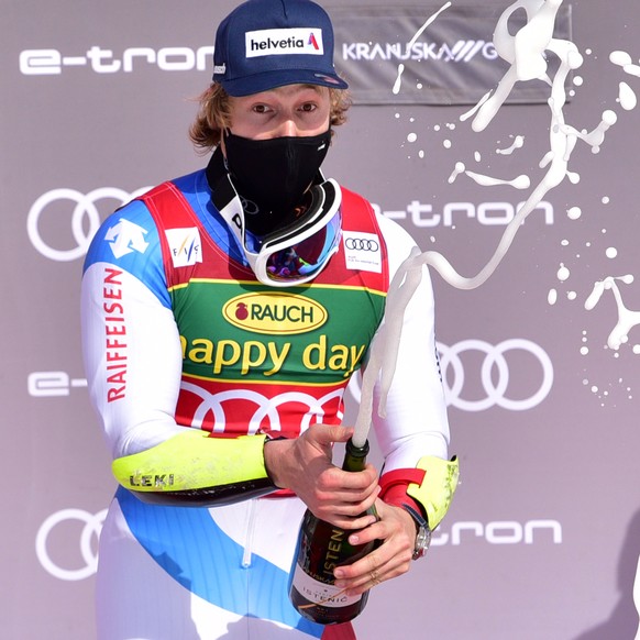 epa09071627 Marco Odermatt of Switzerland celebrates on the podium after winning the men&#039;s Giant Slalom race of the FIS Alpine Skiing World Cup in Kranjska Gora, Slovenia, 13 March 2021. EPA/IGOR ...