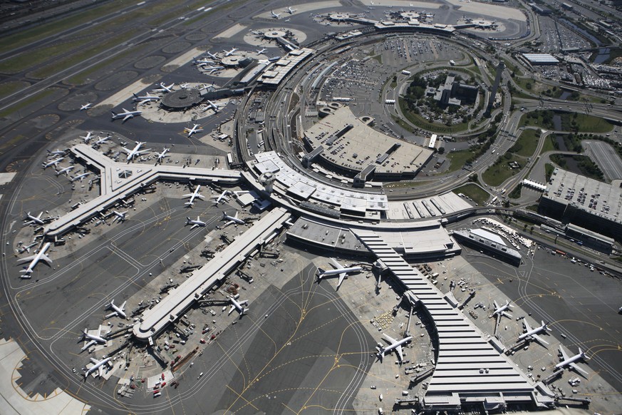 FILE - In this Sept. 8, 2008 file photo, planes are parked at terminals at Newark Liberty International Airport in Newark, N.J. Federal aviation authorities stopped flights from flying into and out of ...