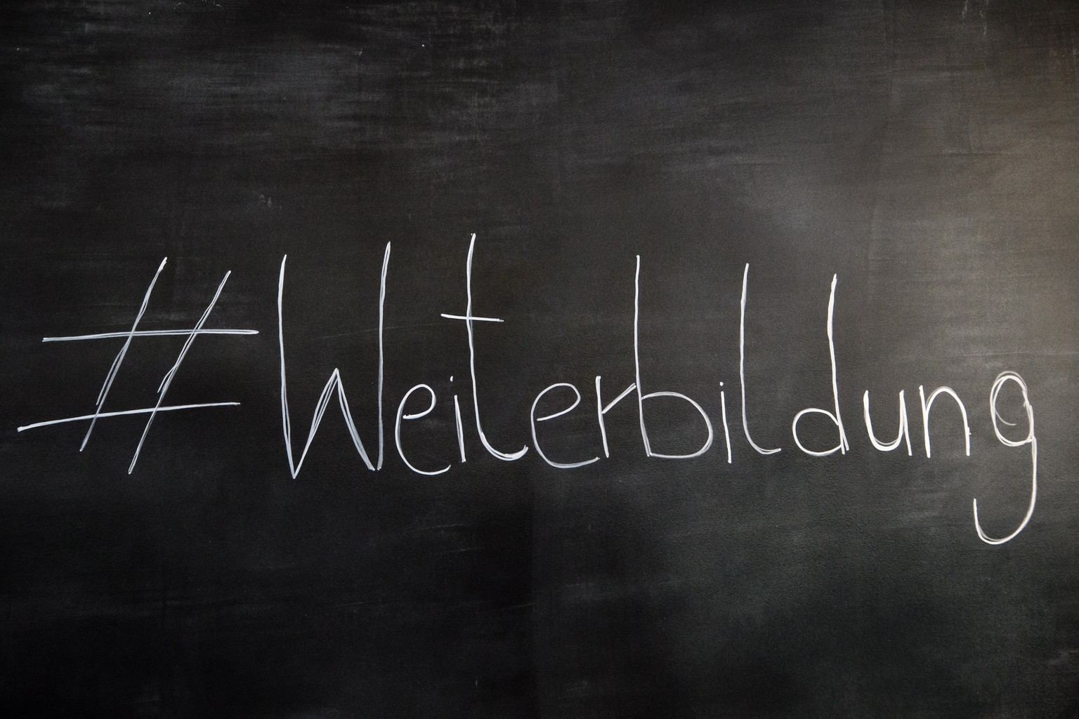epa07643619 The hashtag Furterh Education (Weiterbildung) can be seen on a blackboard during a press conference on the national further education strategy in Berlin, Germany, 12 June 2019. German Mini ...