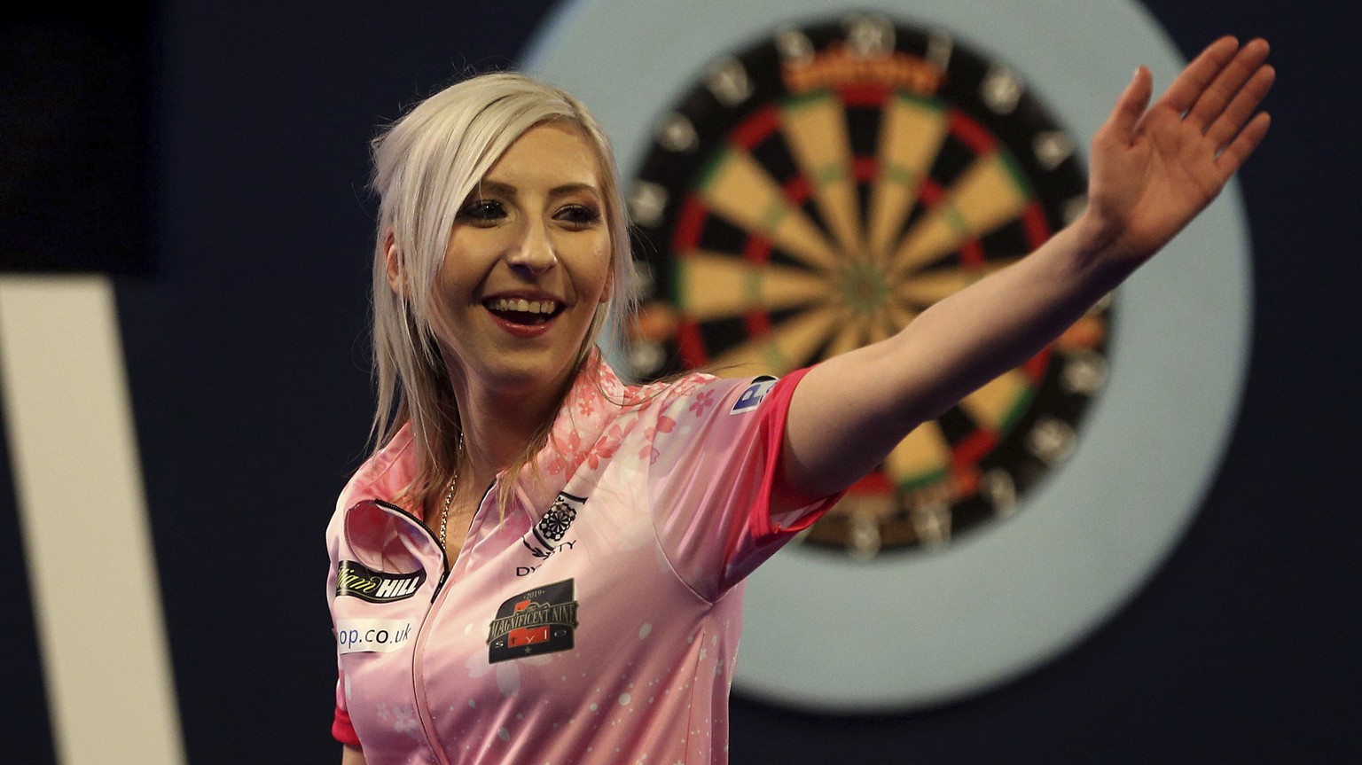 Fallon Sherrock celebrating after becoming the first women to win a game in the PDC Darts World Championship at Alexandra Palace, London, Tuesday Dec. 17, 2019. Sherrock become the first female player ...