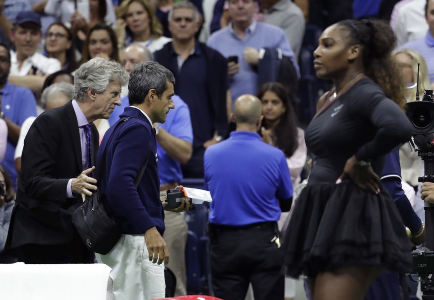 Chair umpire Carlos Ramos, second from left, is lead off the court by referee Brian Earley after Naomi Osaka, of Japan, defeated Serena Williams in the women&#039;s final of the U.S. Open tennis tourn ...