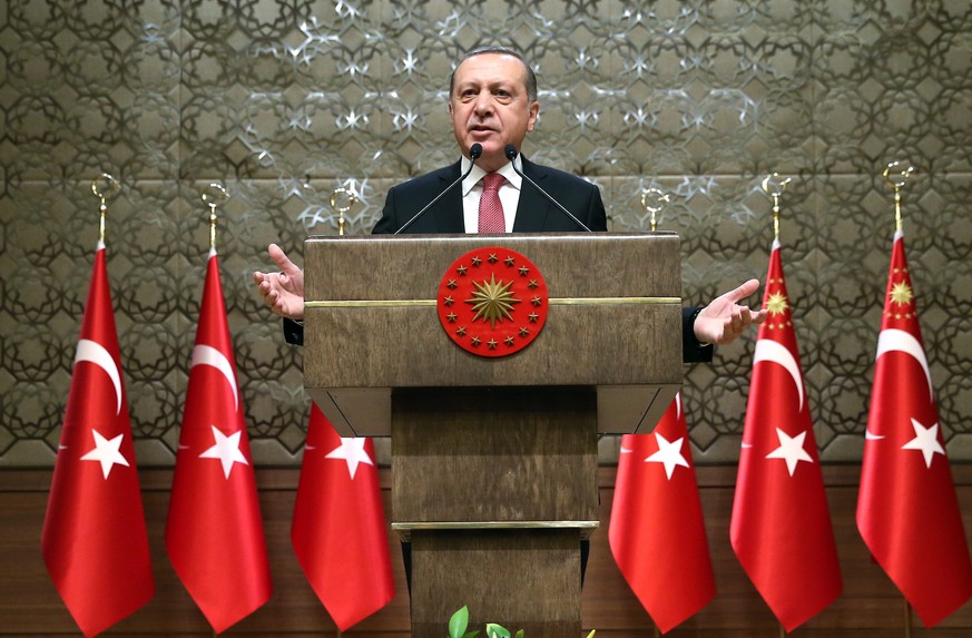 epa05712887 A handout photo made available by Turkish President Press office shows, Turkish President Recep Tayyip Erdogan (C) speaking during the 33rd mukhtars meeting in Ankara , Turkey, 12 January  ...