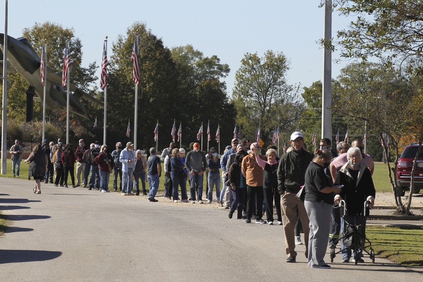 Voters slowly make their way through the long line at the J.T. Neely Building at Veterans Park in Tupelo Miss., Tuesday, Nov. 3, 2020, as they wait to cast their ballot for the next president.(Thomas  ...