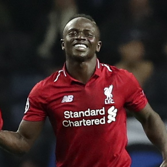 epa07512849 Liverpool&#039;s Sadio Mane (R) celebrates after scoring a goal against FC Porto during their UEFA Champions League quarter final, second leg, soccer match between FC Porto and Liverpool F ...
