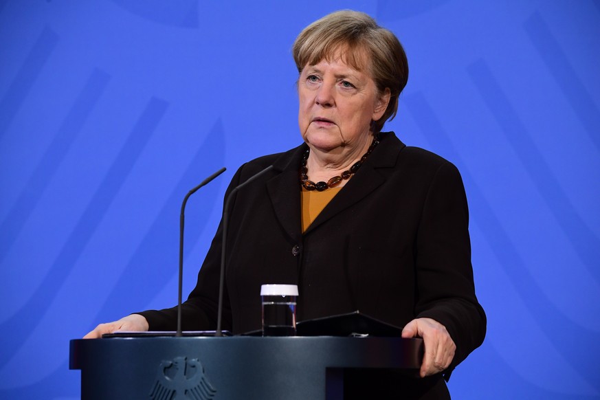 epa09107537 German Chancellor Angela Merkel speaks during a press conference at the chancellery in Berlin, Germany, 30 March 2021. German Chancellor Angela Merkel and German Health Minister Jens Spahn ...