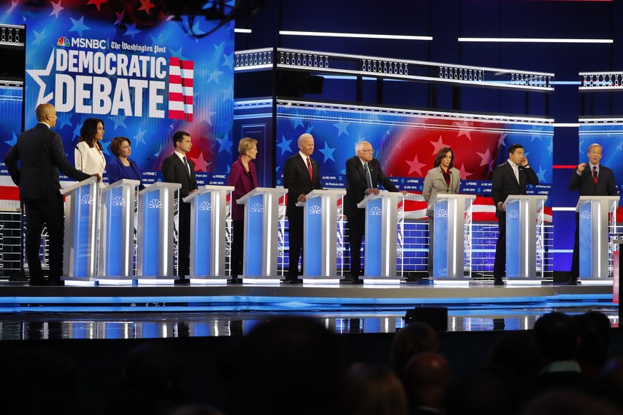 Democratic presidential candidates from left, Sen. Cory Booker, D-N.J., Rep. Tulsi Gabbard, D-Hawaii, Sen. Amy Klobuchar, D-Minn., South Bend, Ind., Mayor Pete Buttigieg, Sen. Elizabeth Warren, D-Mass ...