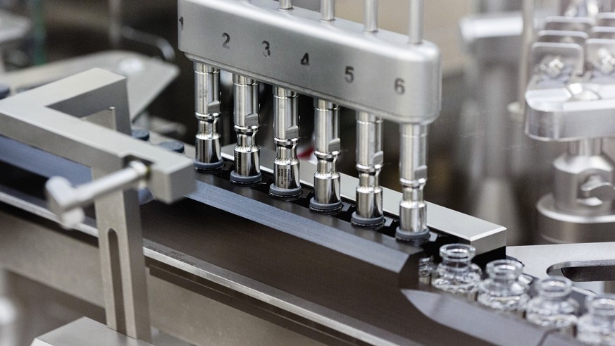 In this March 2020 photo provided by Gilead Sciences, rubber stoppers are placed onto filled vials of the investigational drug remdesivir at a Gilead manufacturing site in the United States. Given thr ...