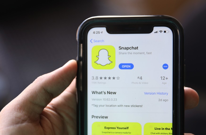 FILE - This July 30, 2019, file photo shows an introduction page for Snapchat shown in a mobile phone displayed at Apple&#039;s App Store in Chicago. Snapchat says it will stop