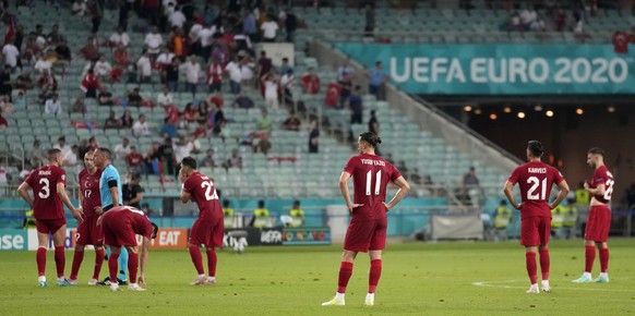 Players of Turkey stand dejected after succeeding a second goal during the Euro 2020 soccer championship group A match between Turkey and Wales the Baku Olympic Stadium in Baku, Azerbaijan, Wednesday, ...