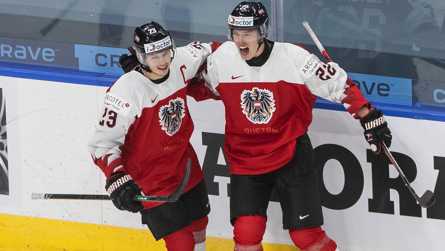 Austria&#039;s Marco Rossi (23) and Senna Peeters (22) celebrate a goal against Russia during the second period of an IIHF World Junior Hockey Championship game Tuesday, Dec. 29, 2020, in Edmonton, Al ...
