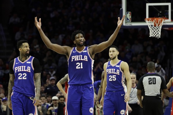 Philadelphia 76ers&#039; Joel Embiid (21) reacts after drawing a foul as Wilson Chandler (22) and Ben Simmons look on during the first half of an NBA basketball game against the Houston Rockets, Monda ...