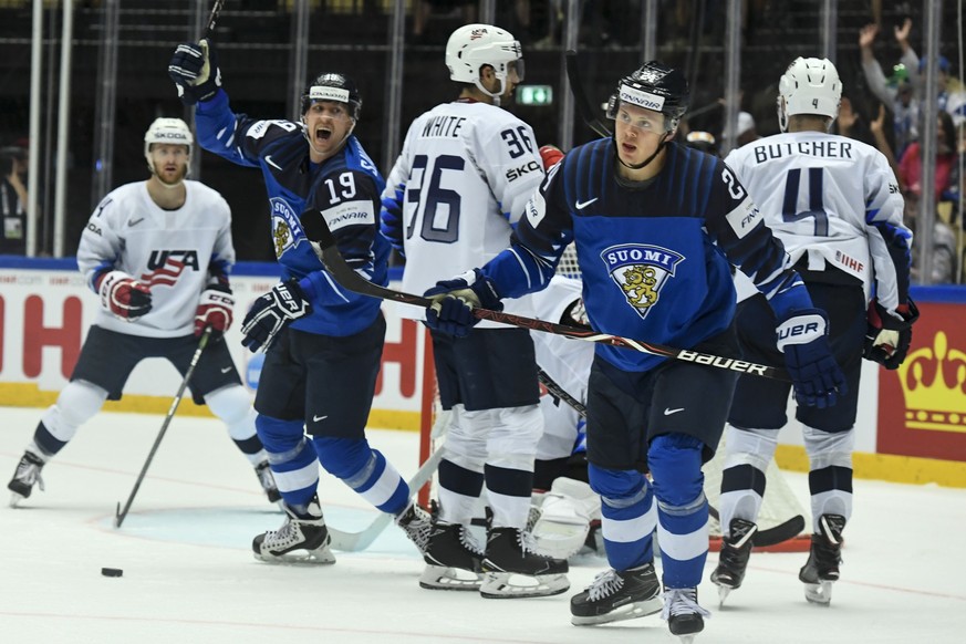 epa06738577 Sebastian Aho (R) of Finland celebrates after scoring a goal during the IIHF World Championship group B ice hockey match between Finland and USA in Jyske Bank Boxen in Herning, Denmark, 15 ...