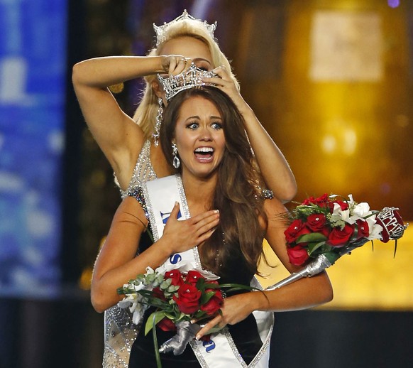 FILE – In this Sept. 10, 2017, file photo, Miss North Dakota Cara Mund reacts after being named Miss America during the Miss America 2018 pageant in Atlantic City, N.J. In a letter sent to former Miss ...