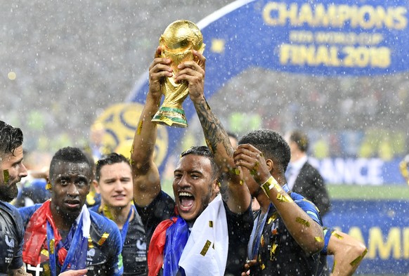France&#039;s Corentin Tolisso celebrates with the trophy after France won 4-2 during the final match between France and Croatia at the 2018 soccer World Cup in the Luzhniki Stadium in Moscow, Russia, ...