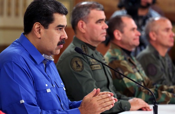 epa07539127 A handout photo made available by the press office of Miraflores shows Venezuelan President Nicolas Maduro speaking during an address transmitted on the mandatory radio and television stat ...