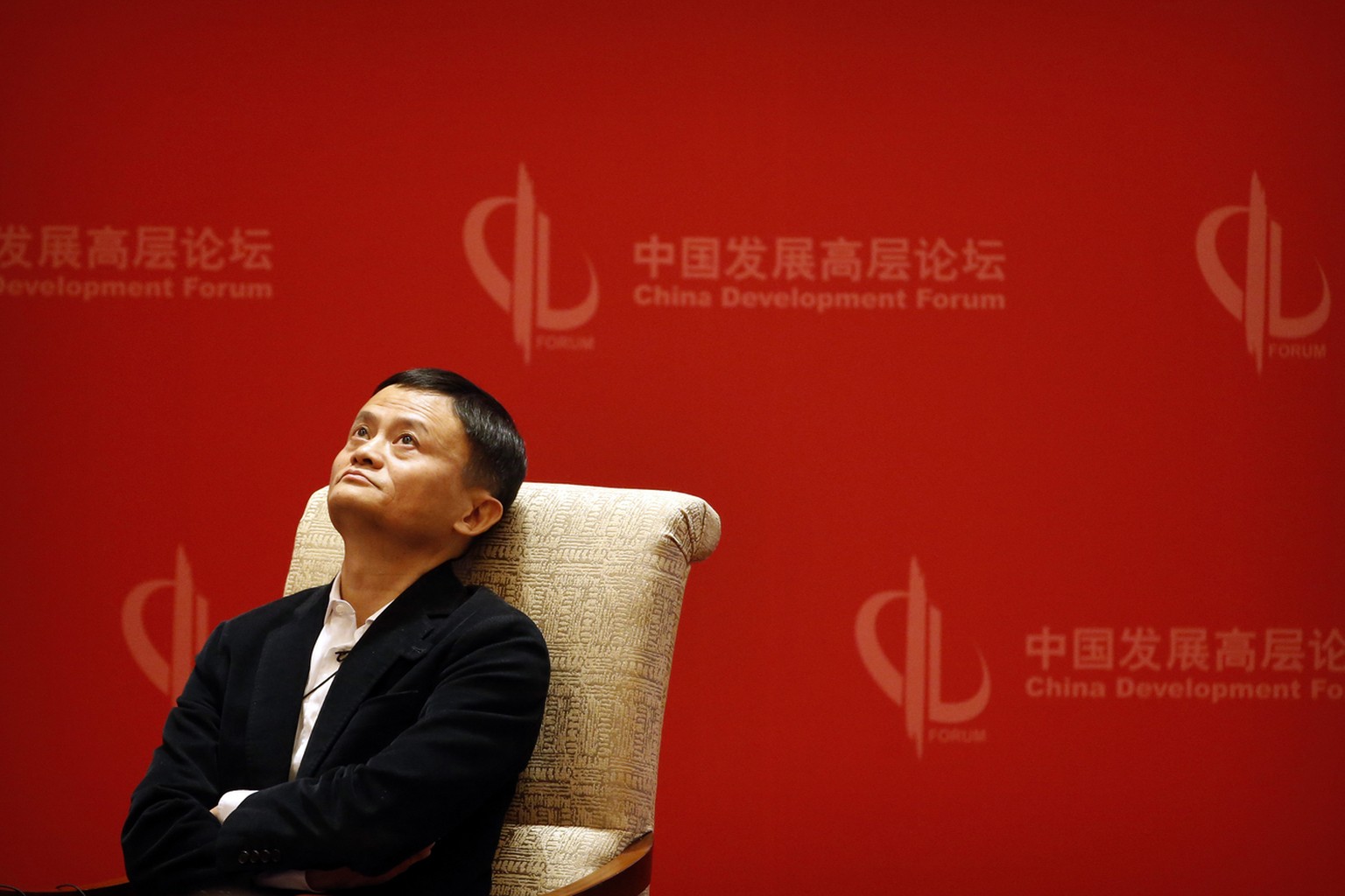 Jack Ma, executive chairman of the Alibaba Group, looks up during a panel discussion held as part of the China Development Forum at the Diaoyutai State Guesthouse in Beijing, Saturday, March 19, 2016. ...