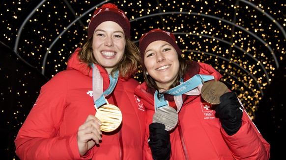 Gold medal winner Michelle Gisin of Switzerland, left, and Bronze medal winner Wendy Holdener of Switzerland, right, pose at the House of Switzerland at the XXIII Winter Olympics 2018 in Pyeongchang,  ...