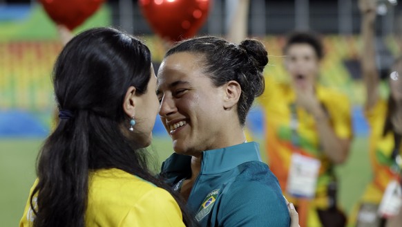 Brazil&#039;s Isadora Cerullo, right, shares a moment with her partner Marjorie Enya, after she was asked her to marry her, after the medal ceremony for the women&#039;s rugby sevens match at the Summ ...
