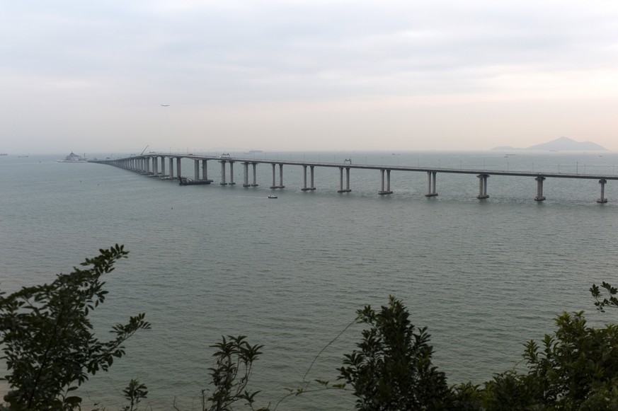 epa06338160 A section of the Hong Kong-Zhuhai-Macau bridge spans across the Pearl River Delta as seen from Lantau Island in Hong Kong, China, 18 November 2017 (issued 19 November 2017). A former labor ...