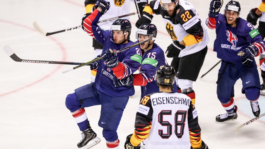 epa07562780 Mike Hammond of Great Britain (L) celebrates his goal with team mate Robert Dowd (C) during the IIHF World Championship group A ice hockey match between Germany and Great Britain at the St ...