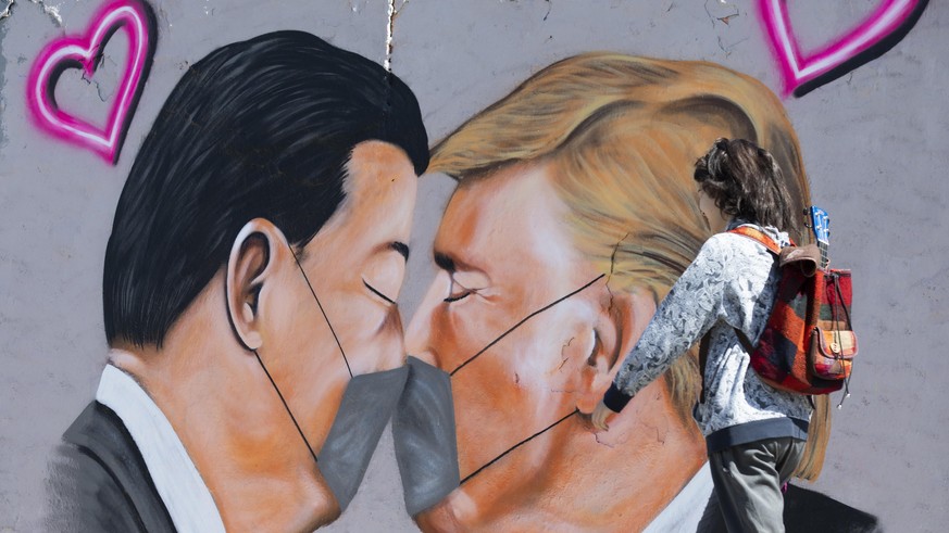 BERLIN, GERMANY - APRIL 27: Graffitis of U.S. President Donald Trump and President of the People&#039;s Republic of China Xi Jinping wearing face mask to draw attention to novel coronavirus (Covid-19) ...