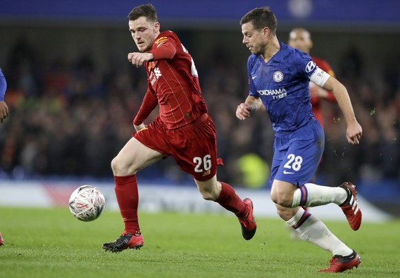 Liverpool&#039;s Andrew Robertson, and Chelsea&#039;s Cesar Azpilicueta battle for the ball during the English FA Cup fifth round soccer match between Chelsea and Liverpool at Stamford Bridge stadium  ...